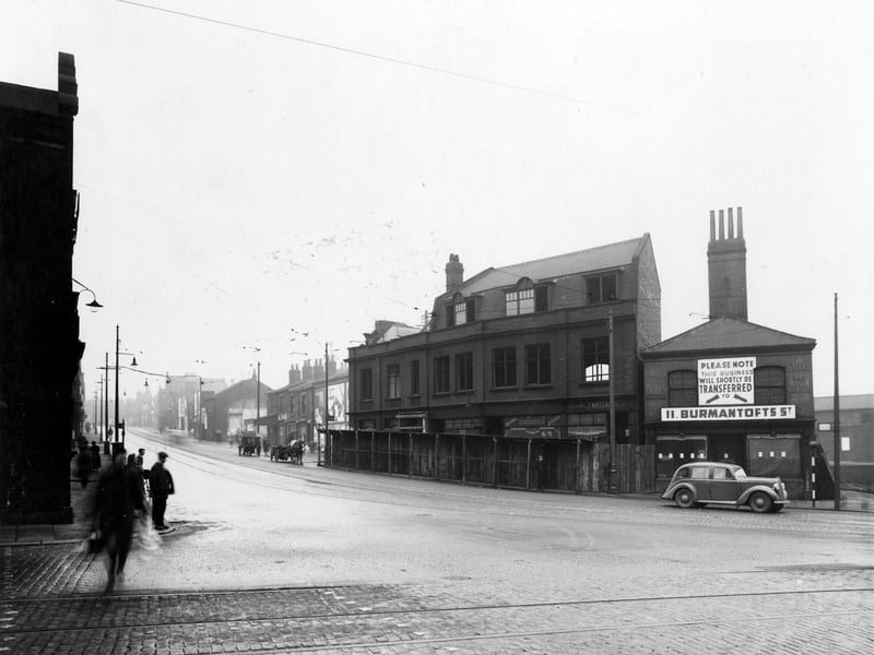 York Road in November 1938. In focus is the junction with Marsh Lane, view of derelict property, shop on the right has notice of transfer to 11 Burmantoft Street