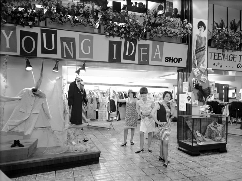 Three women model clothes in front of the Young Idea shop at the Leith Provident, Edinburgh, in May 1966