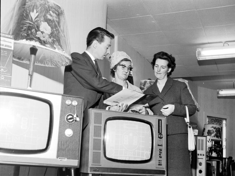 An Evening News & Dispatch Find the Ball competition winner uses her 'Shopping Spree' prize to buy a television set at Telectra House, on Great Junction Street, Leith, in June 1966