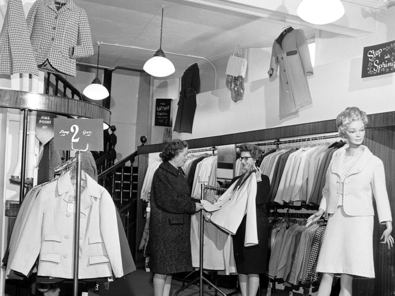 Coats and suits for sale inside J & R Allan department store, on  South Bridge, Edinburgh, in 1966
