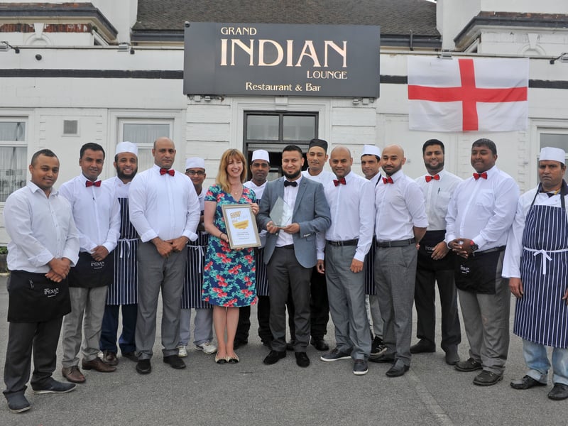 June 2016 and YEP editor Nicola Megson presents the winner of the Curry House of the Year award to Imran Choudhury and the team at the Grand Indian Lounge on Wakefield Road.