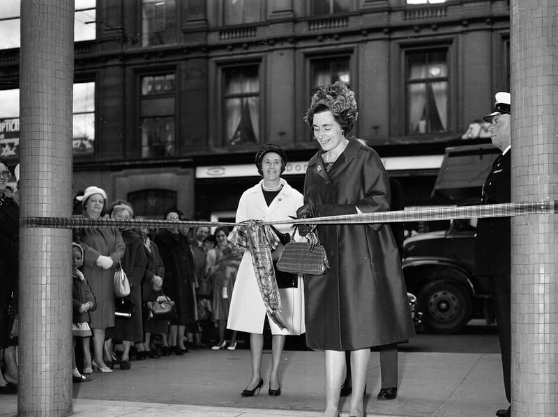 Miss Ann Fraser cuts the ribbon, watched by Lady Fraser, at the Fraser Sons and Co store on Buchanan Street, Glasgow, in May 1962, as it reopens after modernisation