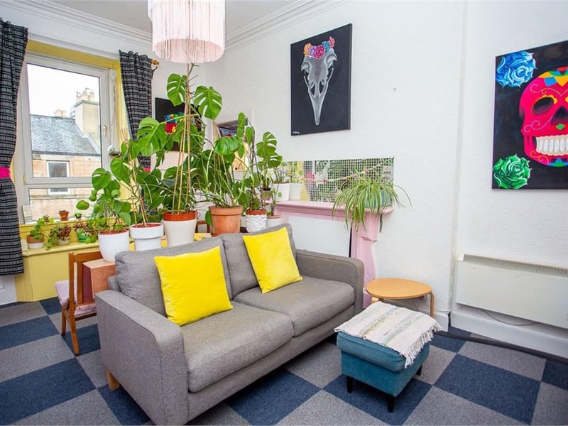 There is a spacious and well-lit sitting room.