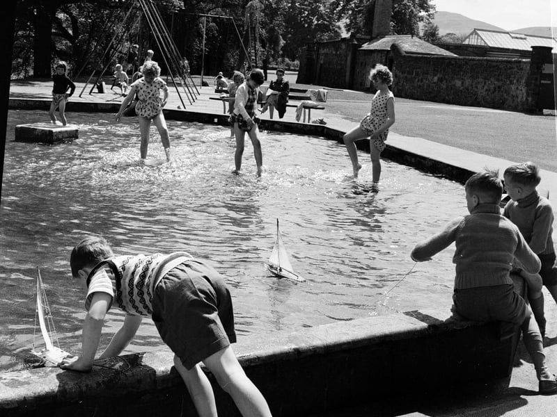 Children play in paddling pool in Saughton Park in July 1963.