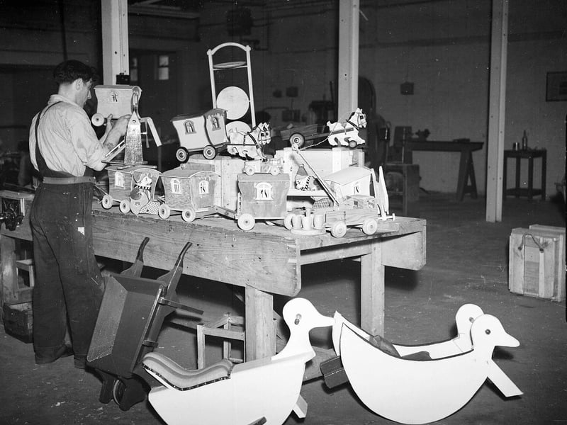 A prisoner making wooden toys in the workshop of Saughton Prison in August 1951.