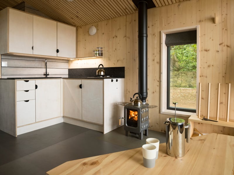 Inside there's everything you need for a relaxed stay - including a wood burning stove should the weather turn chilly.