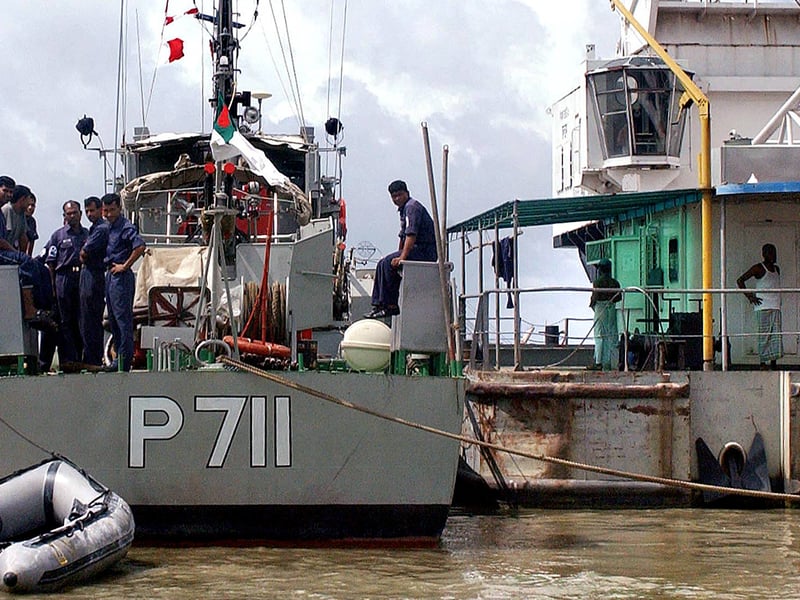 HMS Dovey, a former Royal Navy minesweeper, was sold to Bangladesh in 1995. She is still in active service and is now called BNS Surovi. Pictured: Navy personnel stand on the deck of a ship during search and rescue operations in 2003.