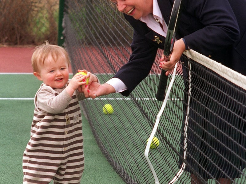 Batley and Spen MP Elizabeth Peacock officially opened the refurbished courts at Hillside Tennis Club in April 1996. She is pictured 14-month-old James Vause, son of the Hillside second team captain Richard Vause.