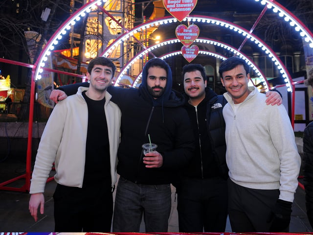 Visitors enjoy the atmosphere at the Fair last night. 