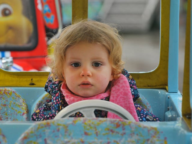 Little Ophelia Dalgaard, 18 months, enjoys the fair. 