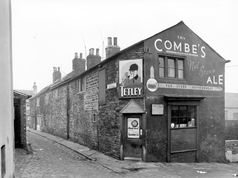 Far Fold on the left with an off licence belonging to Royce Ward, at the gable end of the terrace. Moving left, the next three properties seen are through terraces which face onto Far Fold Place on the right. Pictured in November 1957.