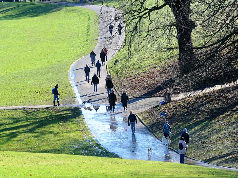 Walkers enjoy the day of sunshine  in Roundhay Park.