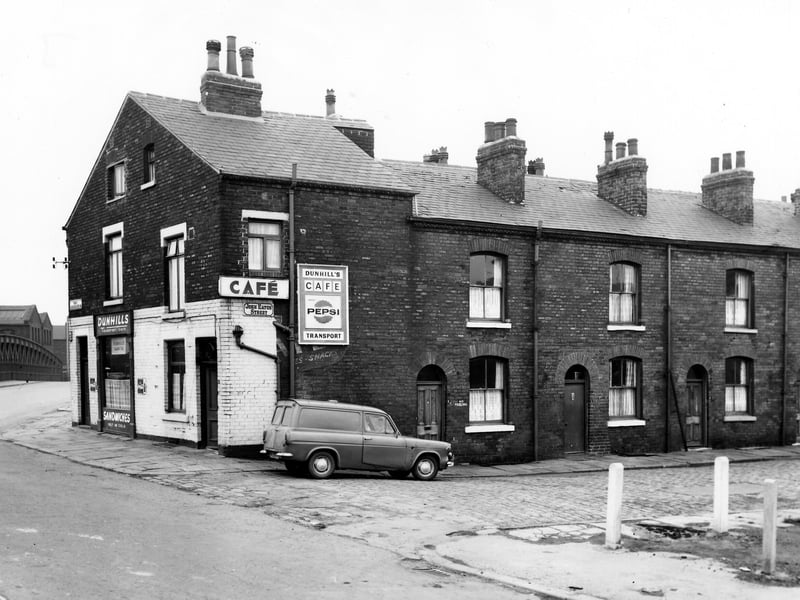 On the left is South Accommodation Road, with suspension bridge over the River Aire. Hunslet was located on the other side of the bridge. Numbers 91/93 South Accommodation Road comprise Dunhill's Transport Cafe. John Eaton Street is to the right, number 1 then 3 in the centre and 5 on the right. Pictured in May 1967.