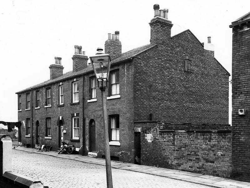 Timber Place was situated off Cross Green Lane, near the junction with East Street. Properties on Timber Place are back-to-back and numbers run from 8 to 11, left to right. A motorbike leans against number 10. On the right are outside toilets. Pictured in May 1967.