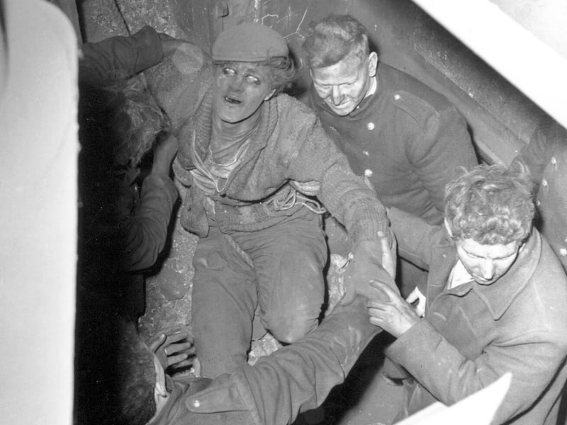 This photo from April 19864 shows Lance Ash being rescued from the 130ft chimney at the warehouse.