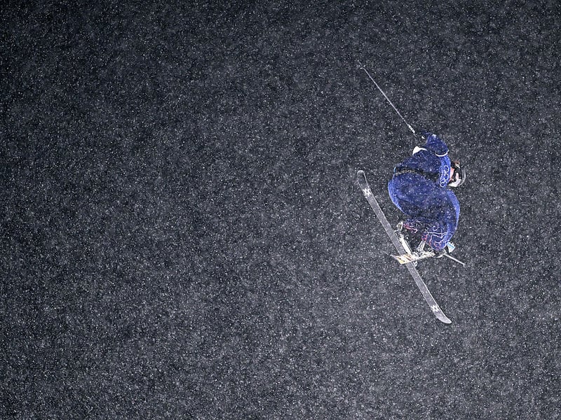 Snow falls during Kirsty Muir's first run in the Freestyle Skiing Women's Freeski Big Air Final.