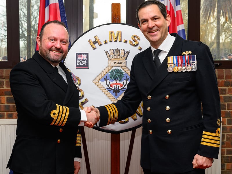 Captain Davey (right) handing over to rank of Commanding Officer of HMS Collingwood to Captain Cromie.