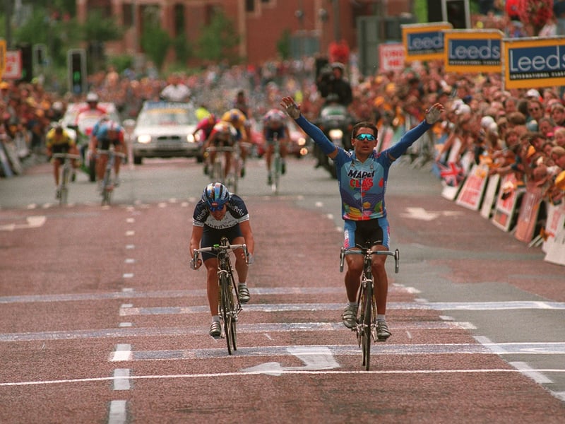  Italian rider Gianluca Bortolami lifts his hands in victory after outsprinting Viatcheslav Ekimov to win the Leeds Classic cycle race in August 1994.
