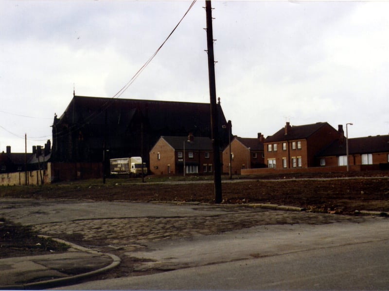A view from Upper Accdommodation Road looking towards Mount St. Mary's Church. In between is a cleared area that had previously been occupied by Elsie View and Ada Crescent. This area has since become the site of new housing on The Spinney and Spinneyfield Croft.