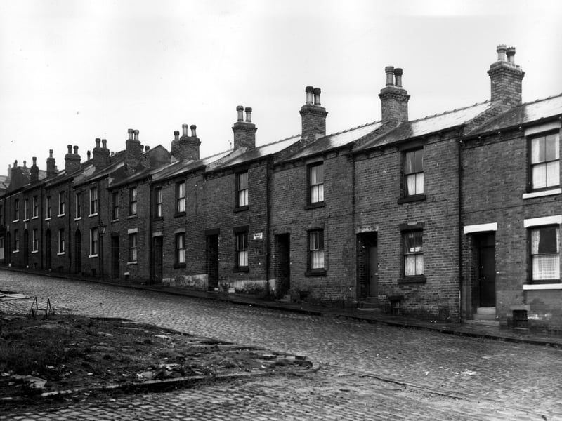 Looking up Woodsley Grove in the direction of Osborne View. Number 34 is on the left, moving right numbers follow in dscending order to 14. In the bottom left corner clearance site had been Verdun Place/Terrace. Pictured in November 1963.