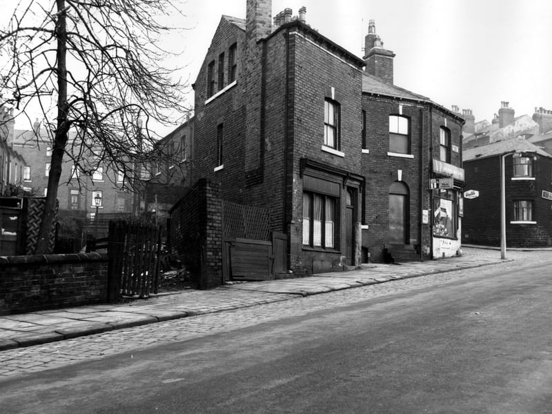 Houses which are just visible on the left edge are on Victoria Mount, this is the rear view showing gardens. Osborne View can be seen at the end. Facing Victoria Mount is the rear of St John's Avenue. Woodsley Road is in the foreground, 59 is in the centre, then 61 and 63. This is an off licence shop situated at the corner with St John's Avenue, business of Joseph Fisher. Pictured in November 1963.