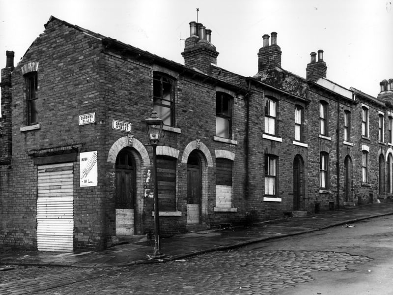 A view looking across Osborne Place to the beginning of Osborne Street in November 1963. These were through properties with entrances on Back Woodsley Grove. Osborne Place is on the left, number 3 Osborne Street, a former shop had a window facing onto Osborne Place, this and number 5 the adjoining house to the right, are derelict. Moving right numbers follow in sequence to 11.