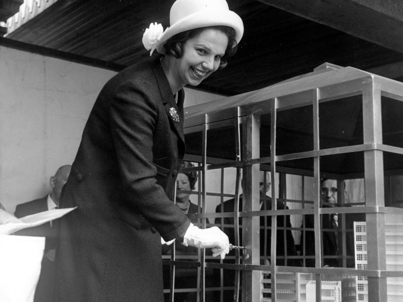 Marjorie Ziff, wife of the chairman of Town Centre securities Ltd, pictured in May 1964 opening a case with a golden key, containing a cake modelled on the shopping centre.