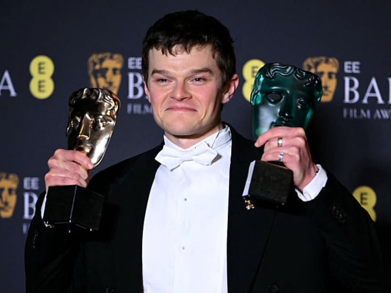 'I Swear' star Robert Aramayo poses with the awards for Best Actor and Rising Star.