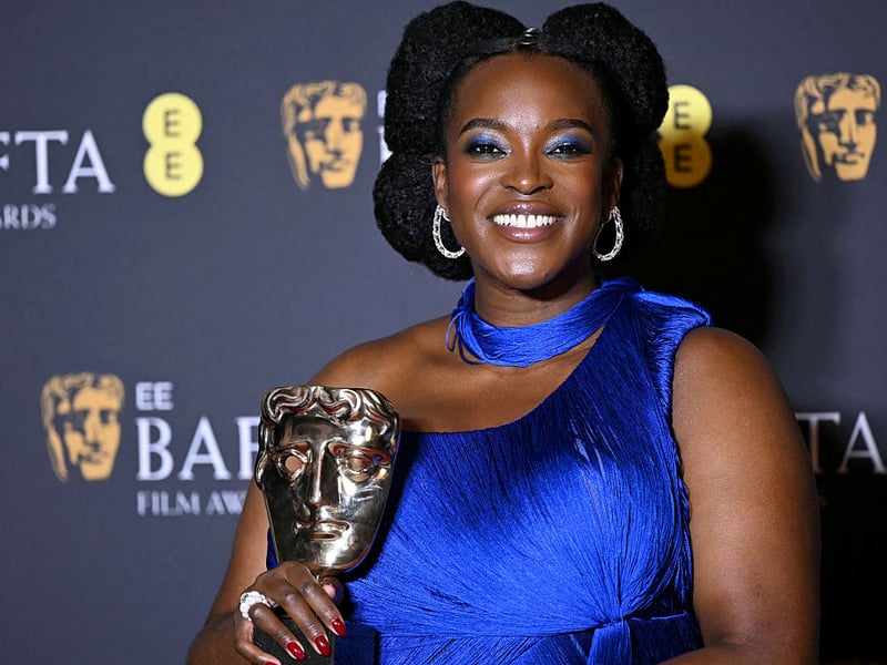 Wunmi Mosaku poses with the award for Best Supporting Actress for her performance in 'Sinners'.