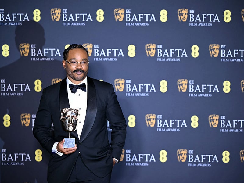 US film director Ryan Coogler poses with the award for Best Orignal Screenplay for 'Sinners'.