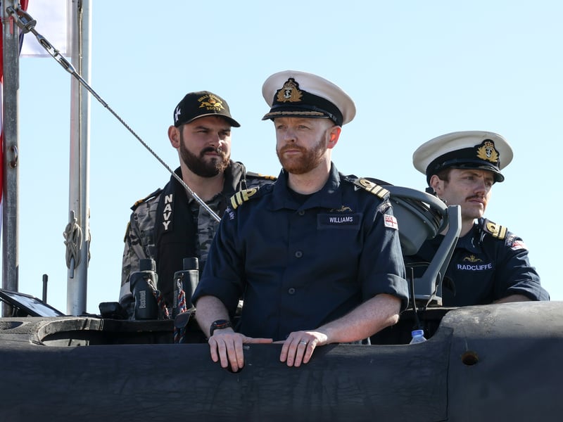 The visit is seen as a crucial part of the ongoing process of supporting Australia to develop the skills and capabilities necessary to operate, maintain and steward conventionally armed, nuclear-powered submarines. Pictured: Commanding Officer Commander Aaron Williams with the Pilot and navigator.