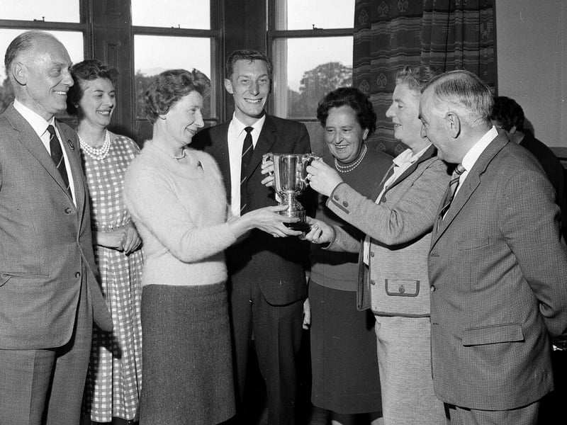 Mrs I O Stewart and Robert Swan receive the Edinburgh Press Charities Trophy at the Liberton Mixed Foursomes Match in July 1965.