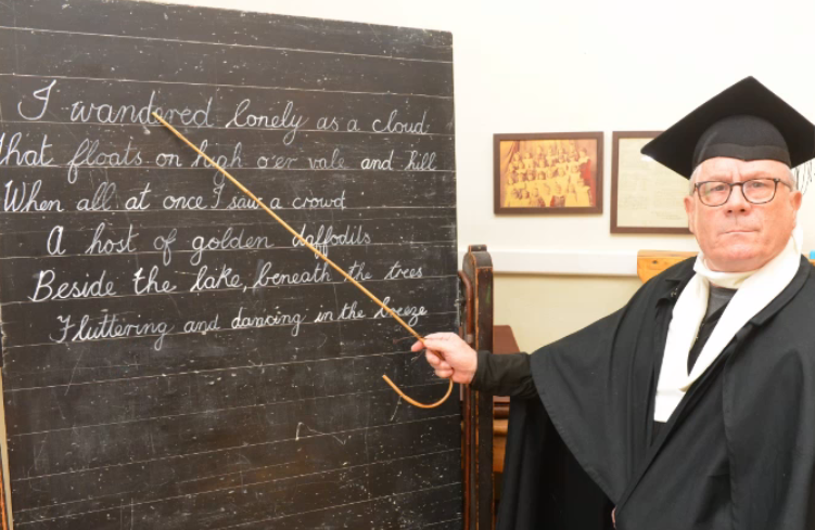 Here's Michael Lynch at the Donnison School blackboard. Who can forget the sound of chalk working its way across a blackboard.