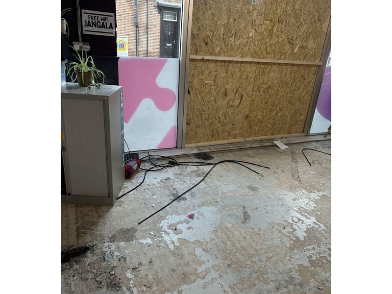 The window has now been boarded up and the clean up is in progress.