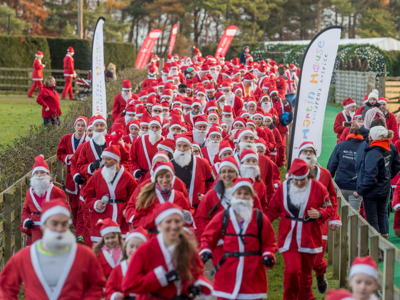 Santa Run in aid of Martin House Hospice held at Stockeld Park in November 2016. Pictured Santa's setting off on their 5k run.