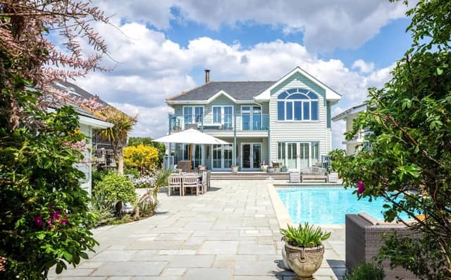 This five bedroom beach house comes with panoramic Solent views and direct access to the sea from a private deck.