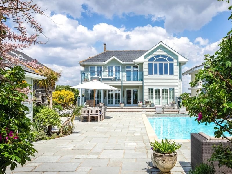 This five bedroom beach house comes with panoramic Solent views and direct access to the sea from a private deck.