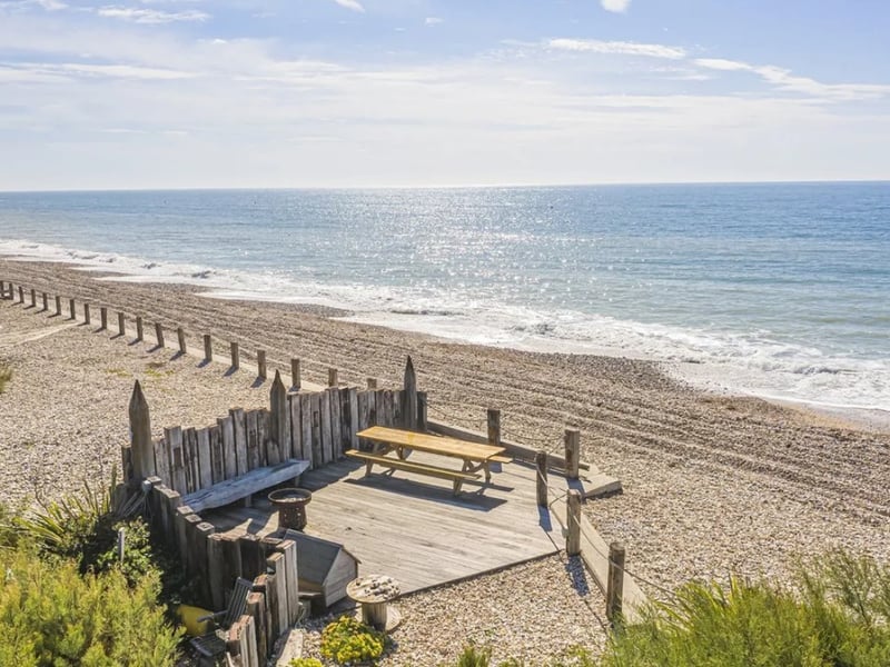 This five bedroom beach house comes with panoramic Solent views and direct access to the sea from a private deck.