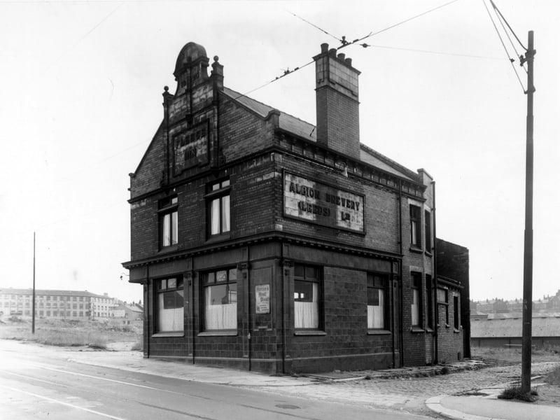 The Fleece Inn, owned by the Albion Brewery, on York Road. The licencee is Gertrude Sammonds and an advertisement for Mercer's Meat Stout is in the window. Tram lines are on the street and tram cables are overhead. Pictured in September 1955.