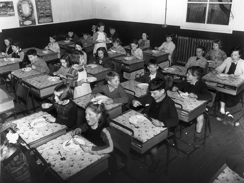 Children eating school meals in Edinburgh's smallest school on Peffermill Road in Craigmillar in November 1954.
