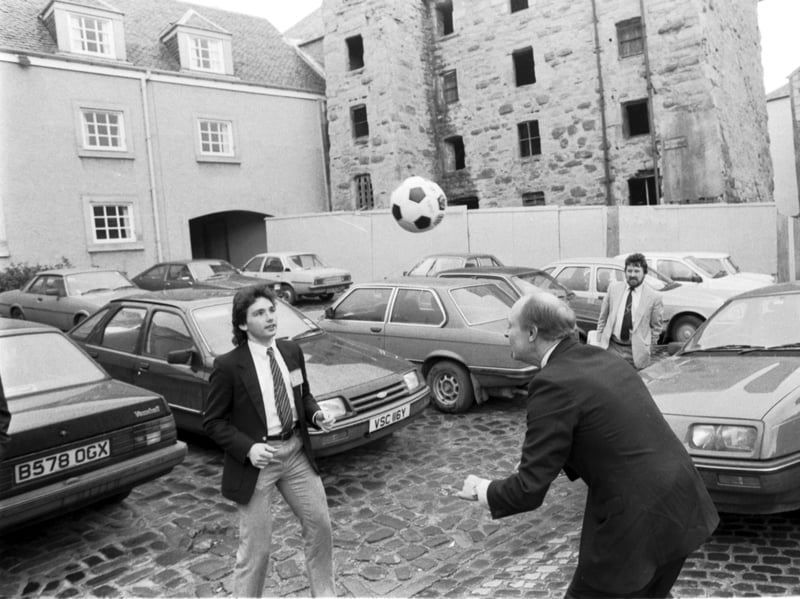 Labour Party leader Neil Kinnock has a kick-about in the car park with Hearts footballer John Colquhoun during the Scottish Labour Party conference in Perth, in March 1986
