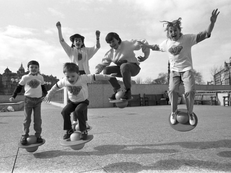 Lisa Coupar (right) and her young friends demonstrate the new Lolobal, an inflatable ball with a foot platform, at the Waverley market shopping centre on Princes Street, Edinburgh, in April 1986