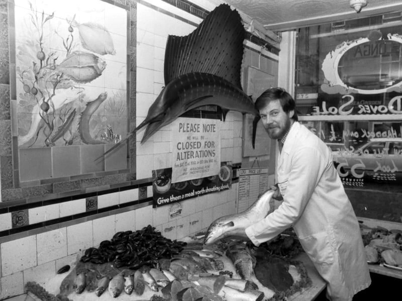 Fishmonger Peter MacIntyre with a display of fish and seafood at his shop (Longa fish, formerly Miller's Fish Shop ) in Tollcross, Edinburgh, in March 1986