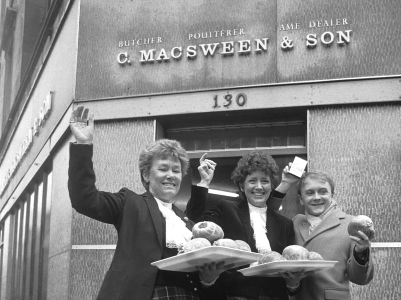 Edinburgh butcher Charles MacSween promotes his world-famous haggis ahead of Burns Night in January 1986. The identity of the women pictured with him is not known.