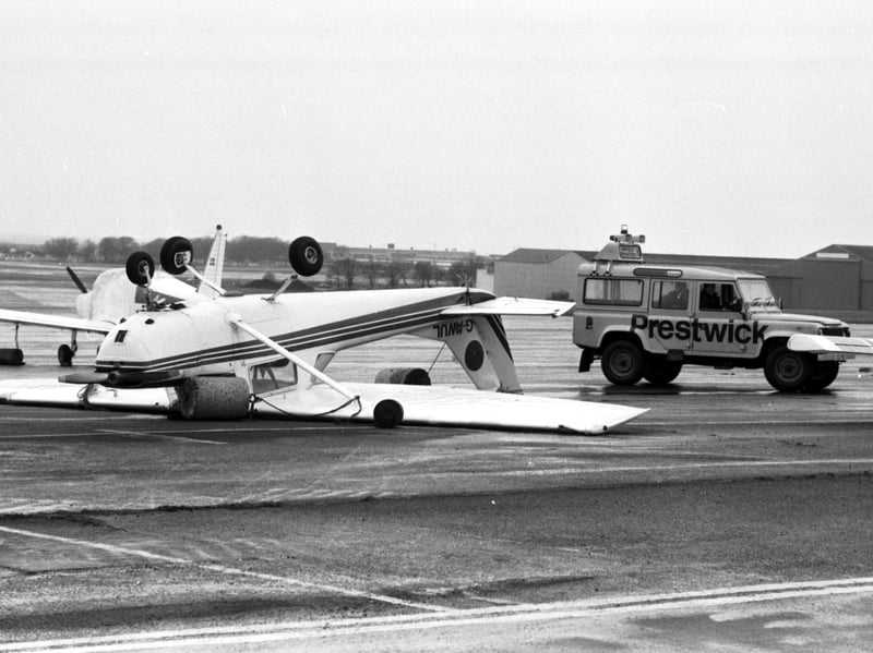 A small light aircraft was flipped onto its back at Prestwick Airport when stormy weather hit Scotland in March 1986