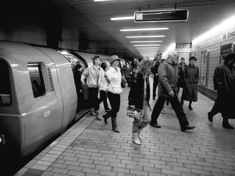 Passengers leave the subway train at St Enoch underground station, Glasgow, in December 1986