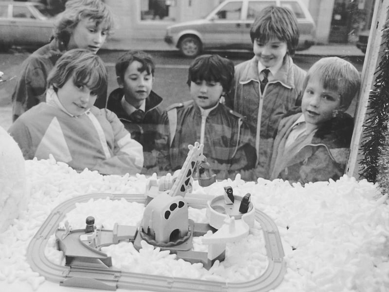 Gazing through the window of a toy shop at the Christmas display in 1986