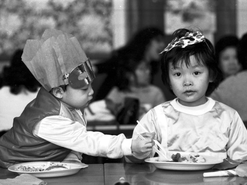 Vietnamese youngsters Mao Sao Trung and Mao Ngo Trung have their last Christmas party at the refugee centre in Glasgow in December 1976. The children were among the 'Vietnamese Boat People' staying in Glasgow temporarily.