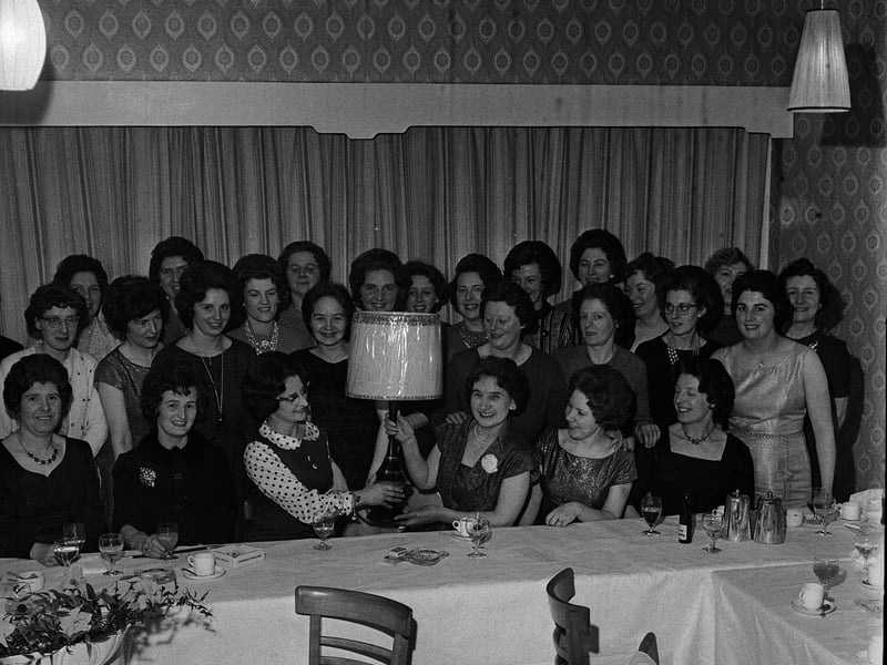 Mrs Martin being presented with a table lamp at Milton House Hotel for 15 years of service at Craigentinny toddlers play centre in February 1964.