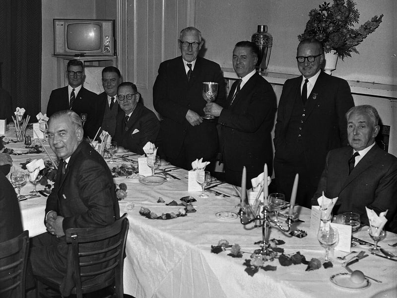 Craigentinny Bowling Club champion R R Watson receives his trophy in October 1964.